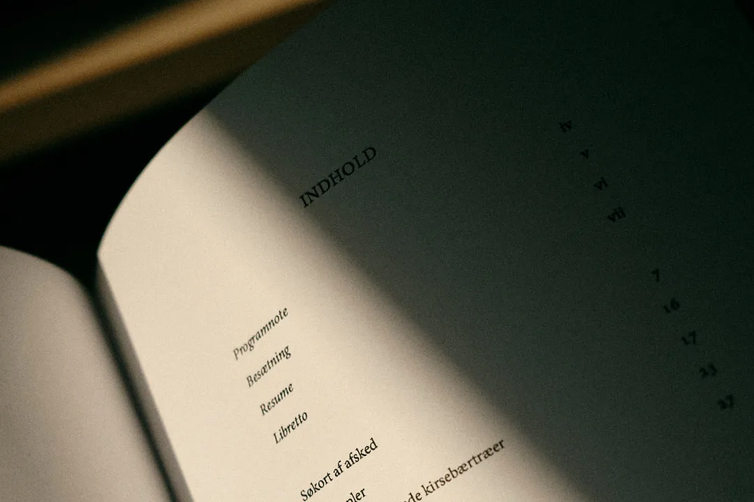 Shadowed page showing table of contents with section list and page numbers.