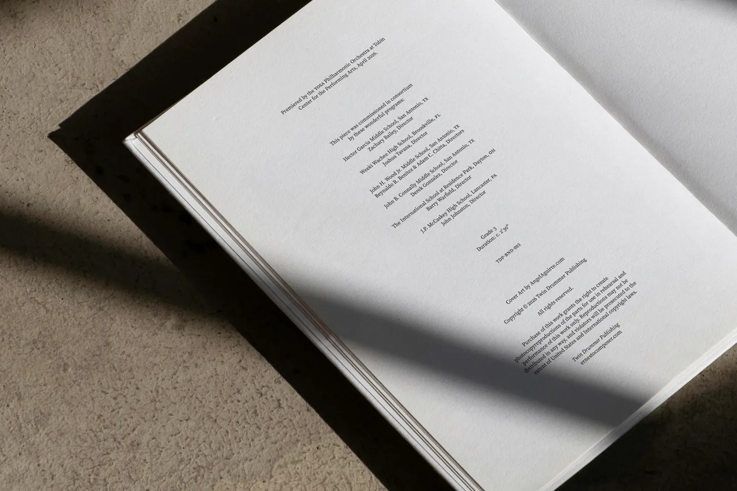 Copyright and commissioning page, dramatic shadow